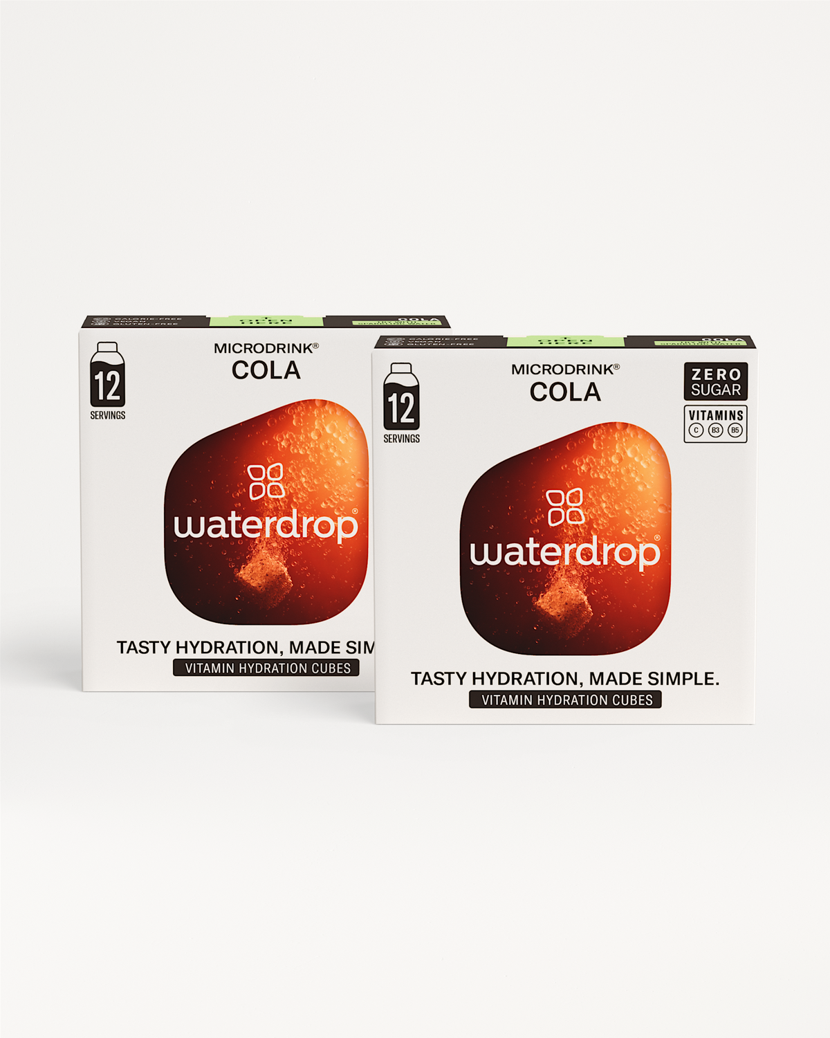 Fizzy Refreshment Twin Pack: Two retail boxes of waterdrop Microdrink® Cola vitamin hydration cubes, 12-serving, zero-sugar, vitamin-enriched, offering cola-flavored hydration.