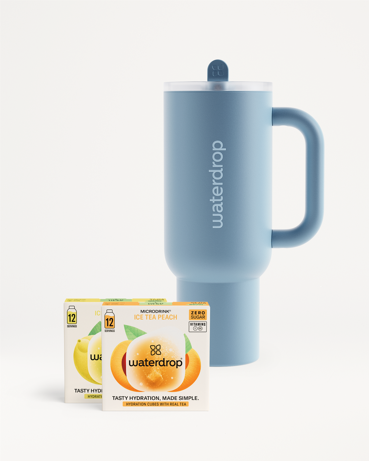 Chill Mode Set: Pastel-blue insulated travel mug with Waterdrop branding, accompanied by Ice Tea Peach and lemon microdrink boxes for a refreshing, sugar-free summer chill.