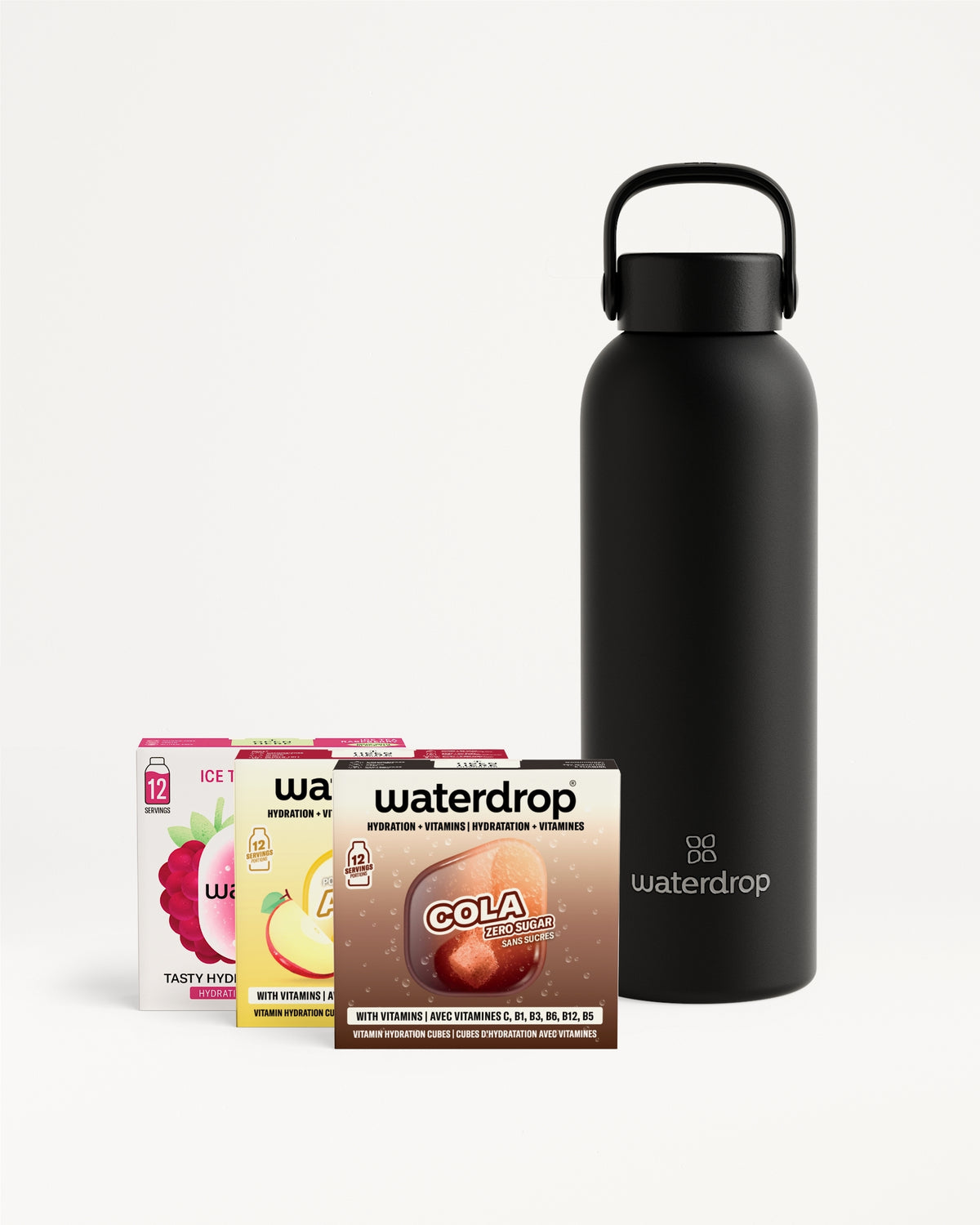 Black insulated water bottle with a carrying handle beside a set of flavor drop boxes.