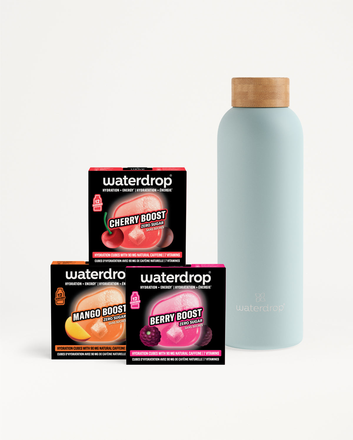 Assorted Waterdrop flavor boxes and a light blue bottle with a wooden cap.