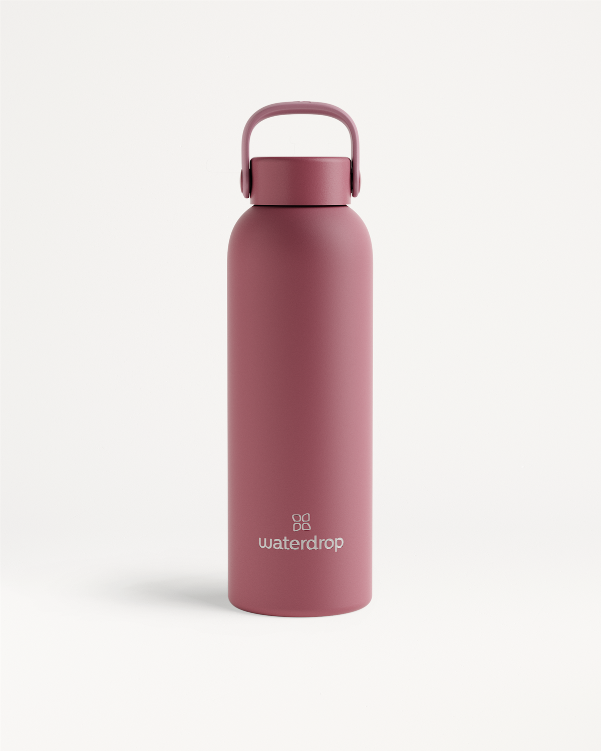 Thermo Steel Bottle · Carry Cap, a matte-pink stainless-steel insulated bottle with a screw-on lid and handle, featuring the “waterdrop” logo near the base.