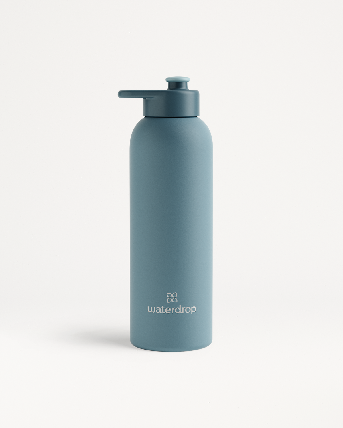 Thermo Steel Bottle · Pull-Up Cap; a double-walled stainless steel bottle with a screw-on lid, flip-up spout, and logo near the base.