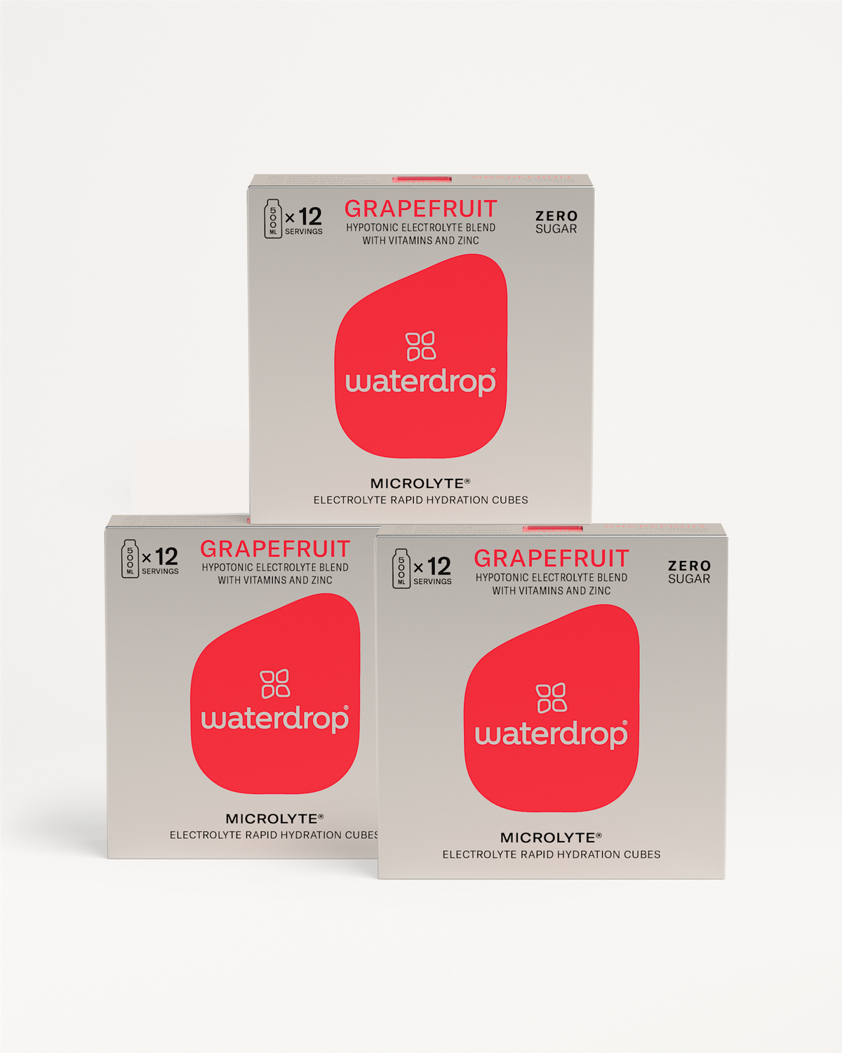 Microlyte 2+1: Three boxes of grapefruit-flavored, zero-sugar electrolyte cubes, each for 12 servings, featuring a hypotonic blend with vitamins and zinc for rapid hydration.