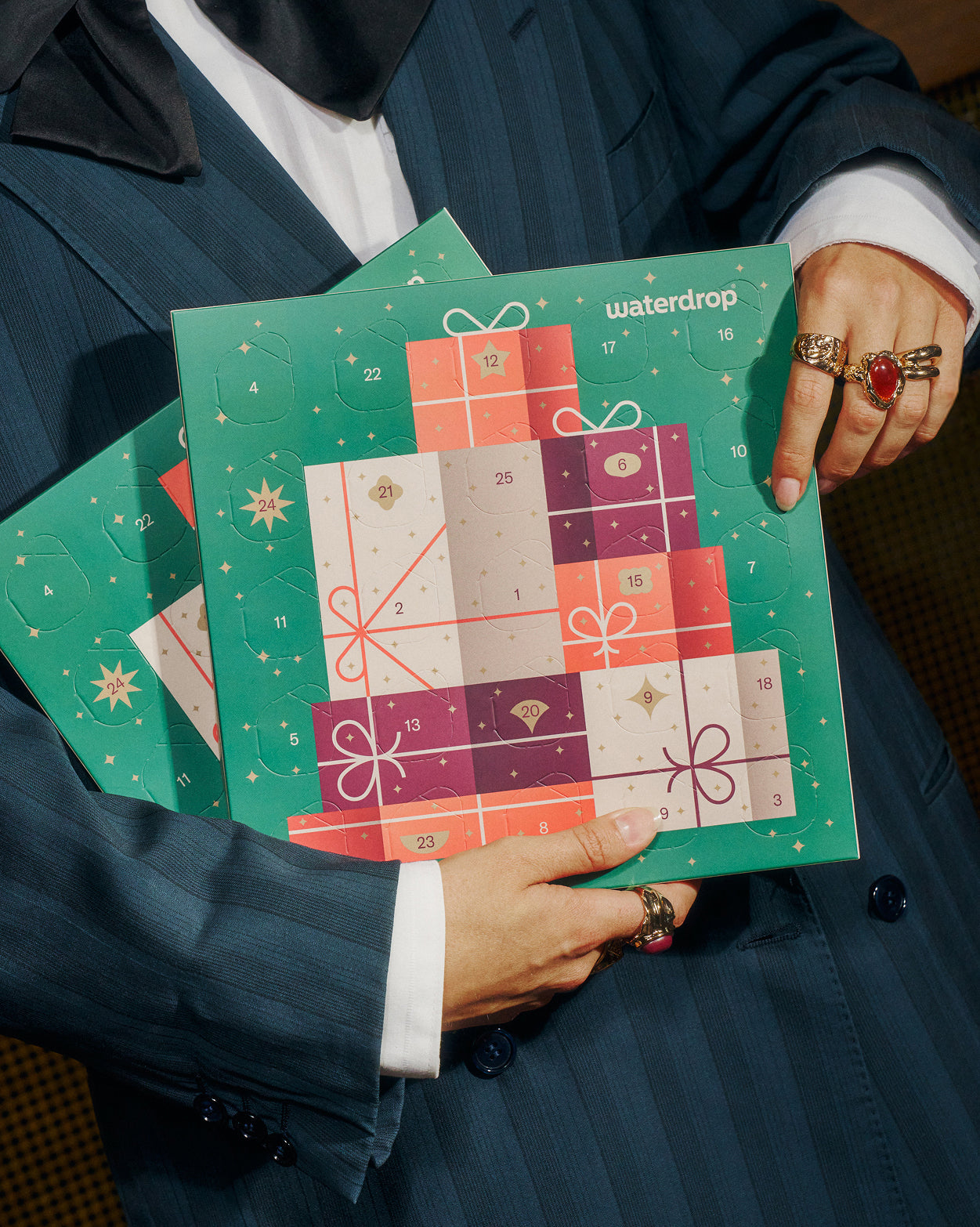 Advent Calendar Small Twin Pack held by a person.