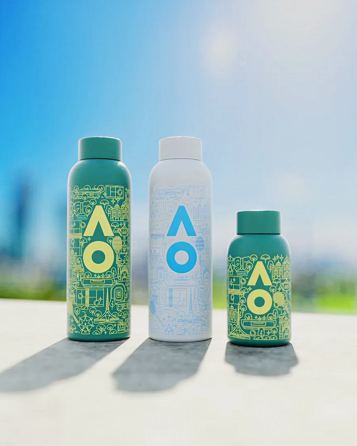 AO26 Family Hydration Set: Three vacuum-insulated bottles with line-art design.