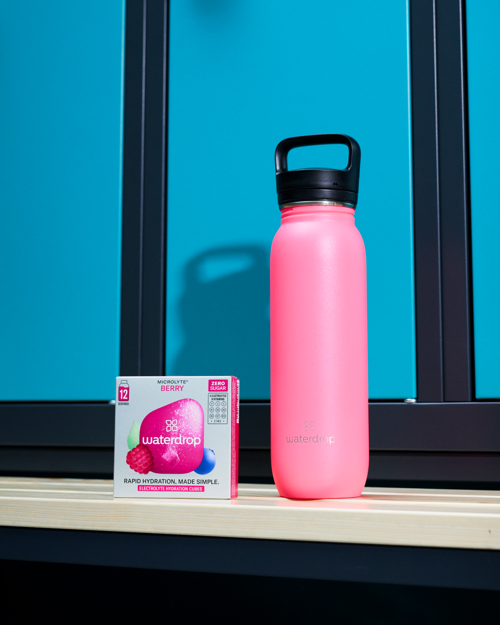 Microlyte BERRY Twin Pack featuring a pink water bottle and packaging, designed for rapid hydration with electrolytes, vitamins, and zinc.
