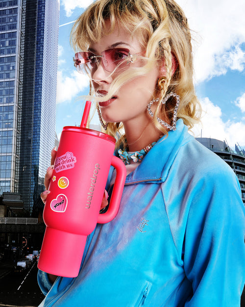 Neon Pink Explorer Set tumbler with playful stickers.