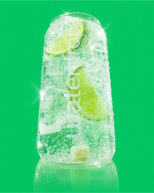 Best of Soft Drinks Set in transparent can with lime wedges.