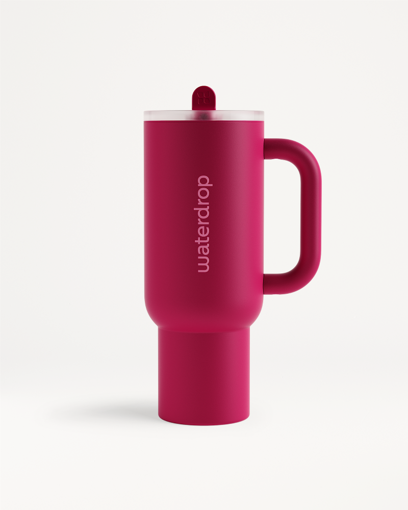 Fusion Explorer Thermo Tumbler in close-up, showcasing its sleek design with a distinctive red lid and cylindrical shape, ideal for stylish sipping.