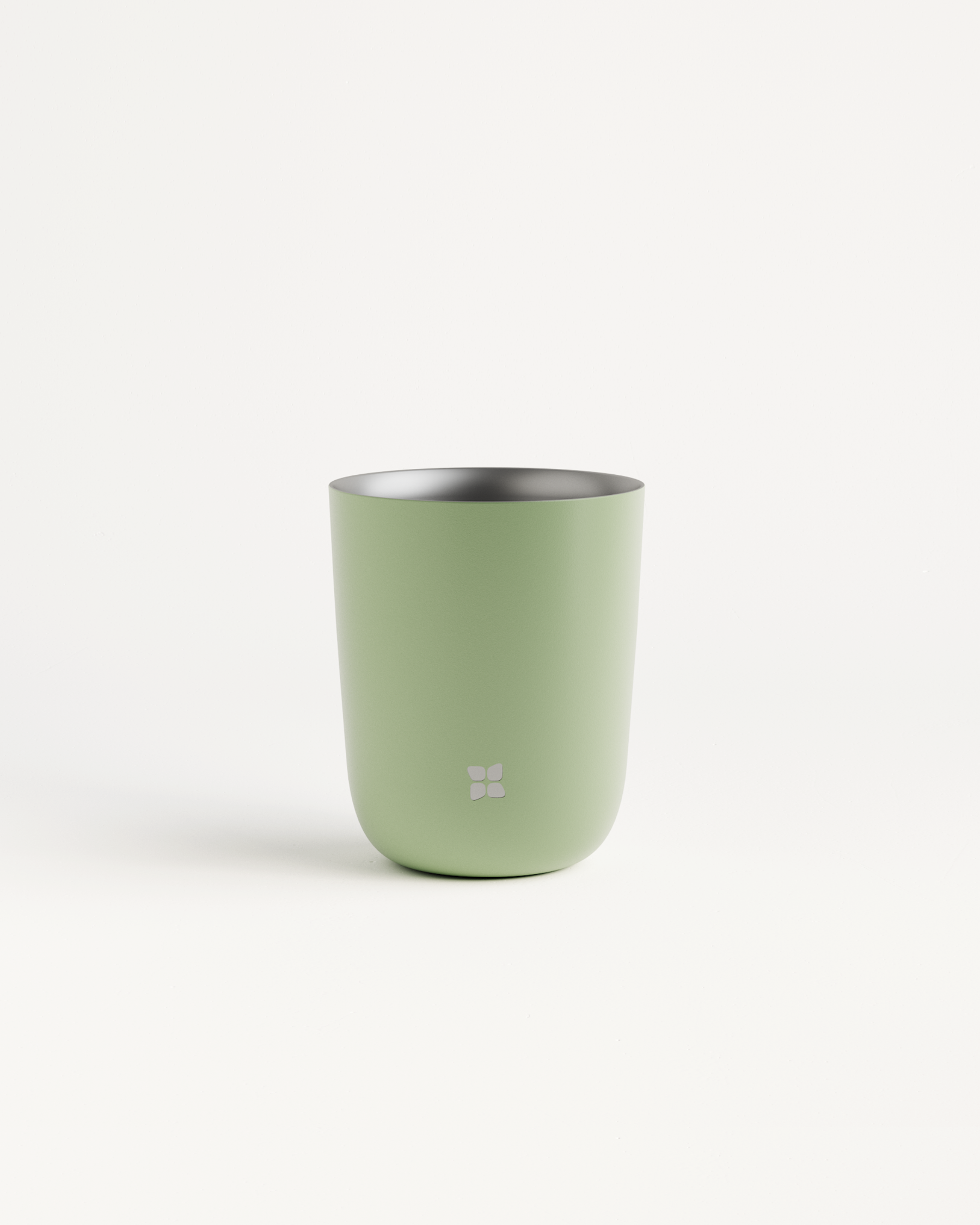 Steel Cup with silver rim and white logo; double-walled and heat-resistant, ideal for hot or cold drinks.