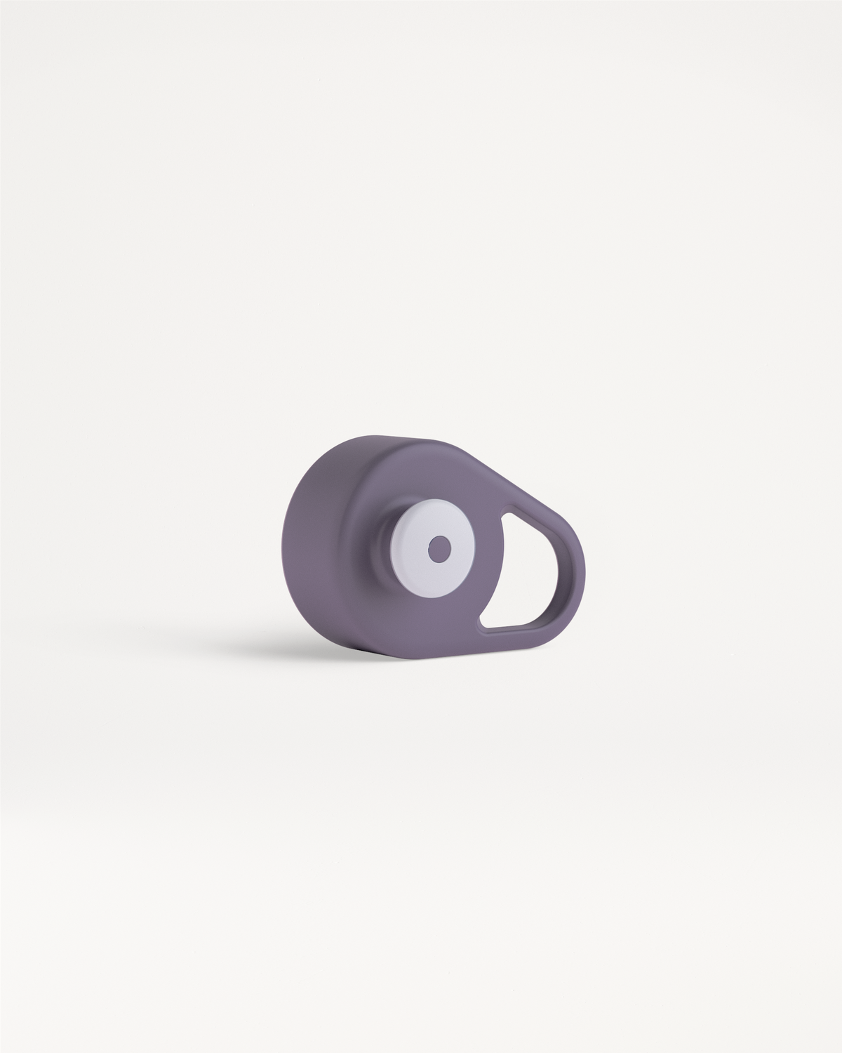 Pull-Up Cap: A compact gadget with a smooth-edged design, featuring a circular button and loop, ideal for easy hydration during workouts or travel.