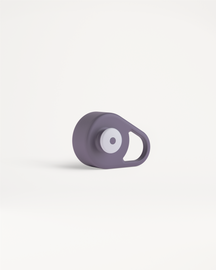 Pull-Up Cap: A compact gadget with a smooth-edged design, featuring a circular button and loop, ideal for easy hydration during workouts or travel.
