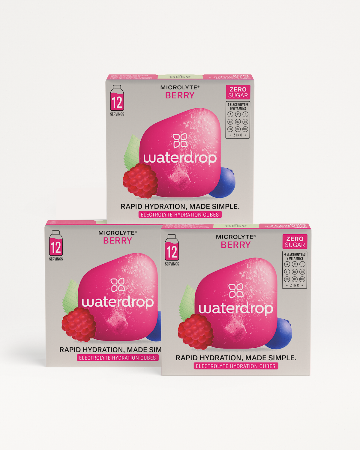 Microlyte 2+1 Berry electrolyte hydration cubes in three boxes, featuring zero sugar, 12 servings, 4 electrolytes, 9 vitamins, zinc, and berry graphics for rapid hydration.