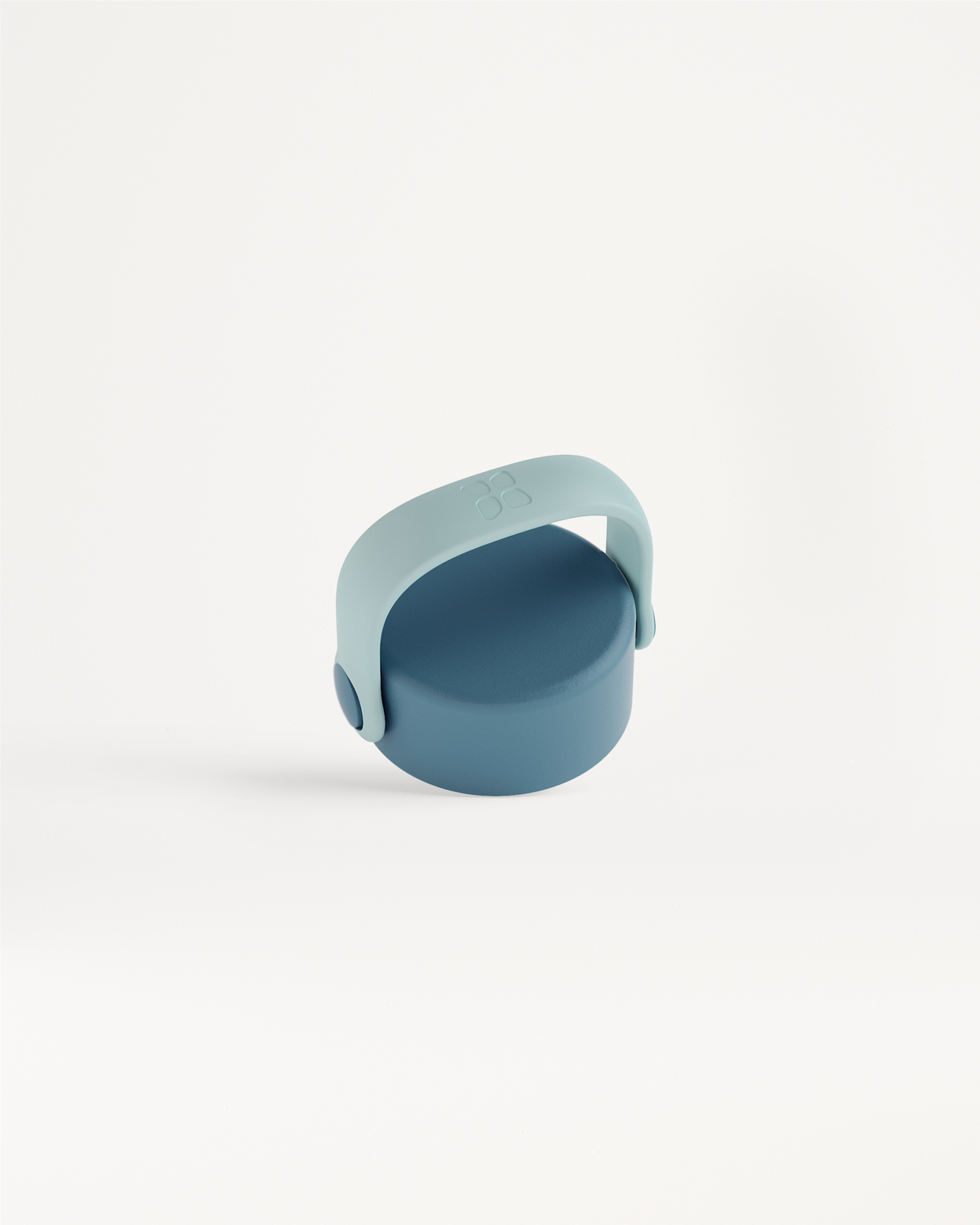 Carry Cap with a two-piece design featuring a matte-textured cap and U-shaped handle, ideal for easy transport and carabiner attachment.