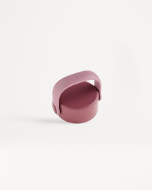 Carry Cap featuring a circular lid with a strap-style handle, designed for easy carrying or attachment to bags with a carabiner.