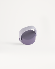 Carry Cap: A small, round container with a pivoting U-shaped handle on top, designed for easy transport with an integrated loop for carabiner attachment.