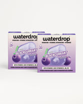 Two purple Waterdrop boxes with berry imagery.