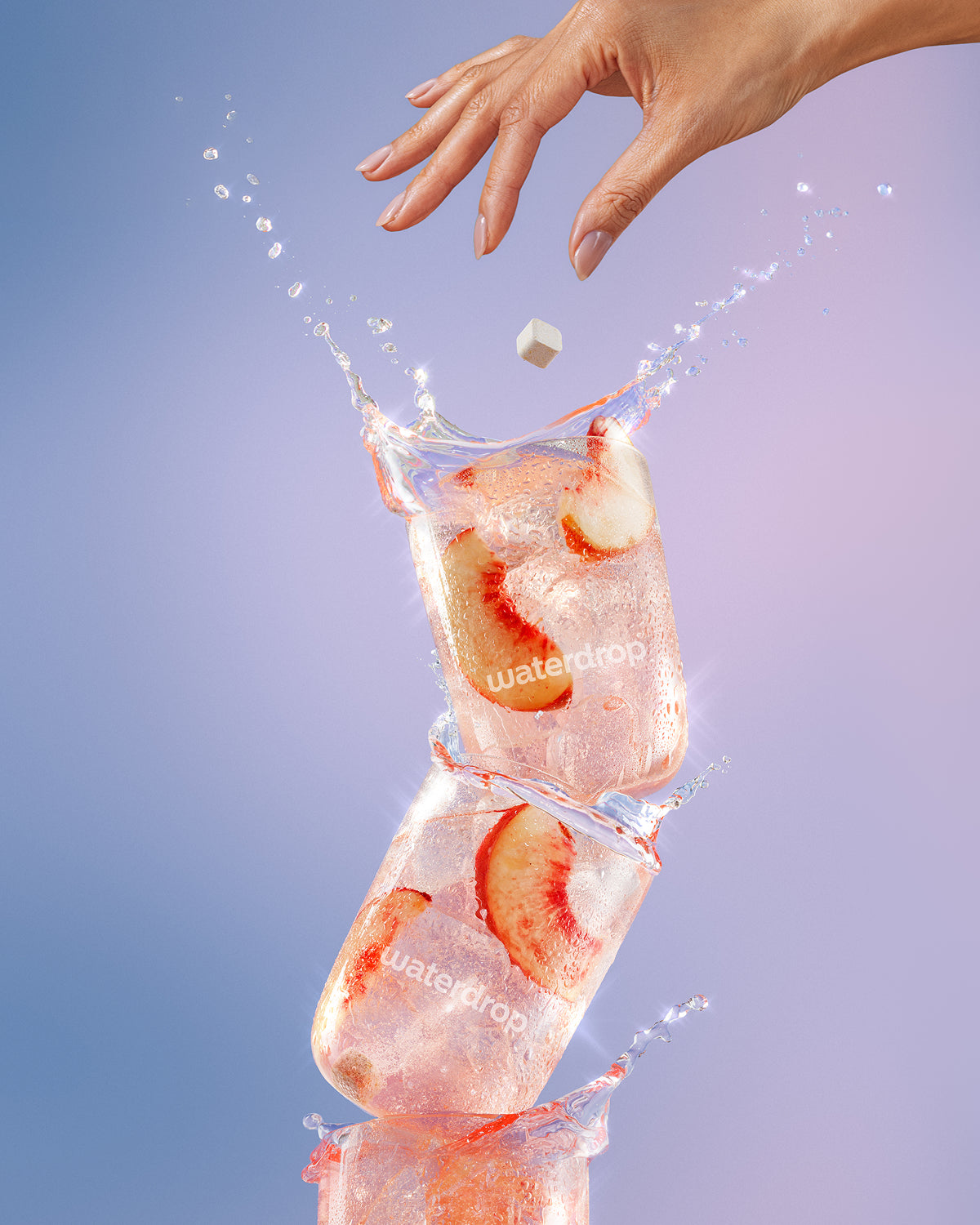Stacked ice cubes with strawberry slices and a hand dropping a cube, with water splashes.