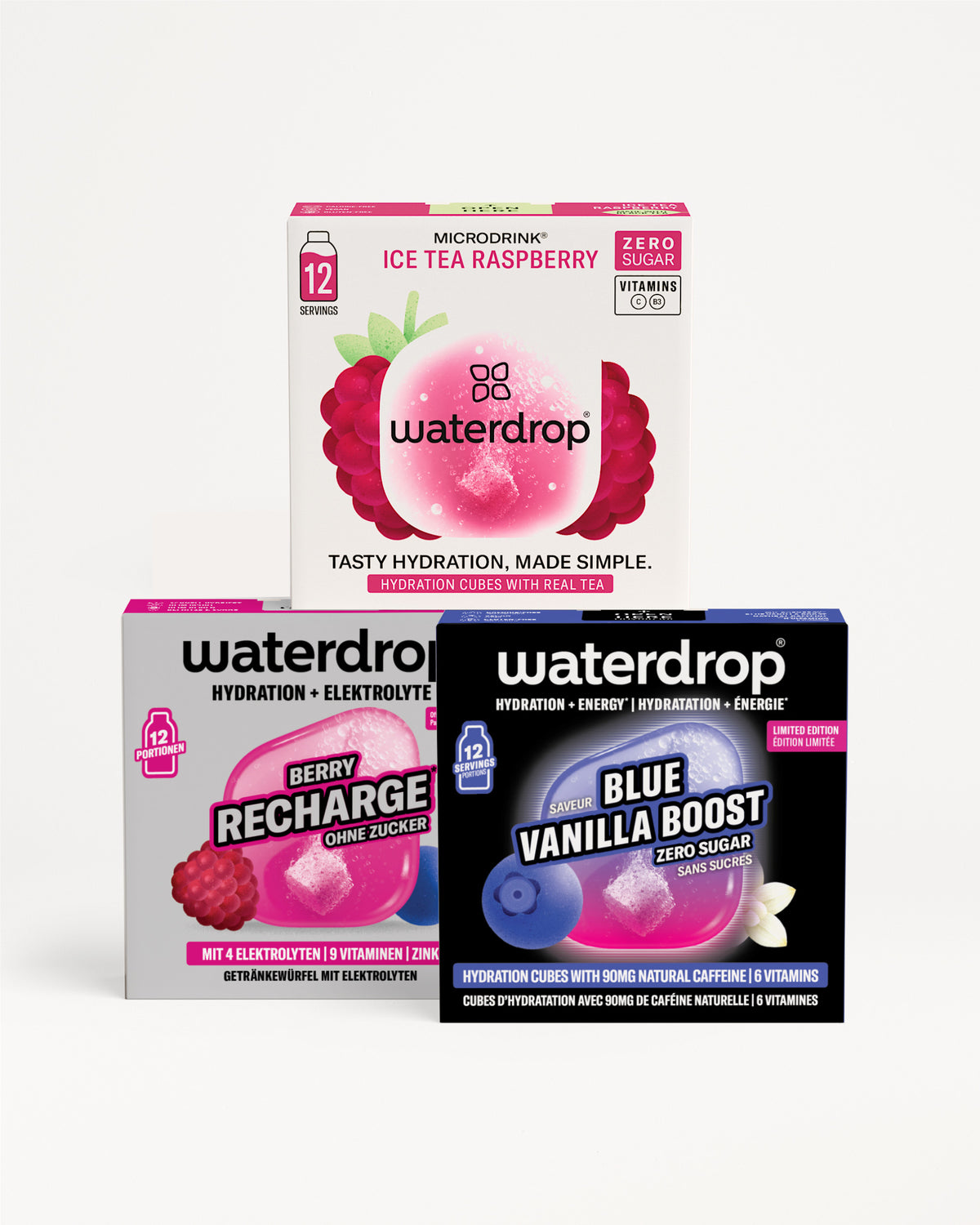 Three Waterdrop hydration boxes stacked in a pyramid, showing pink, purple, and blue packaging designs.