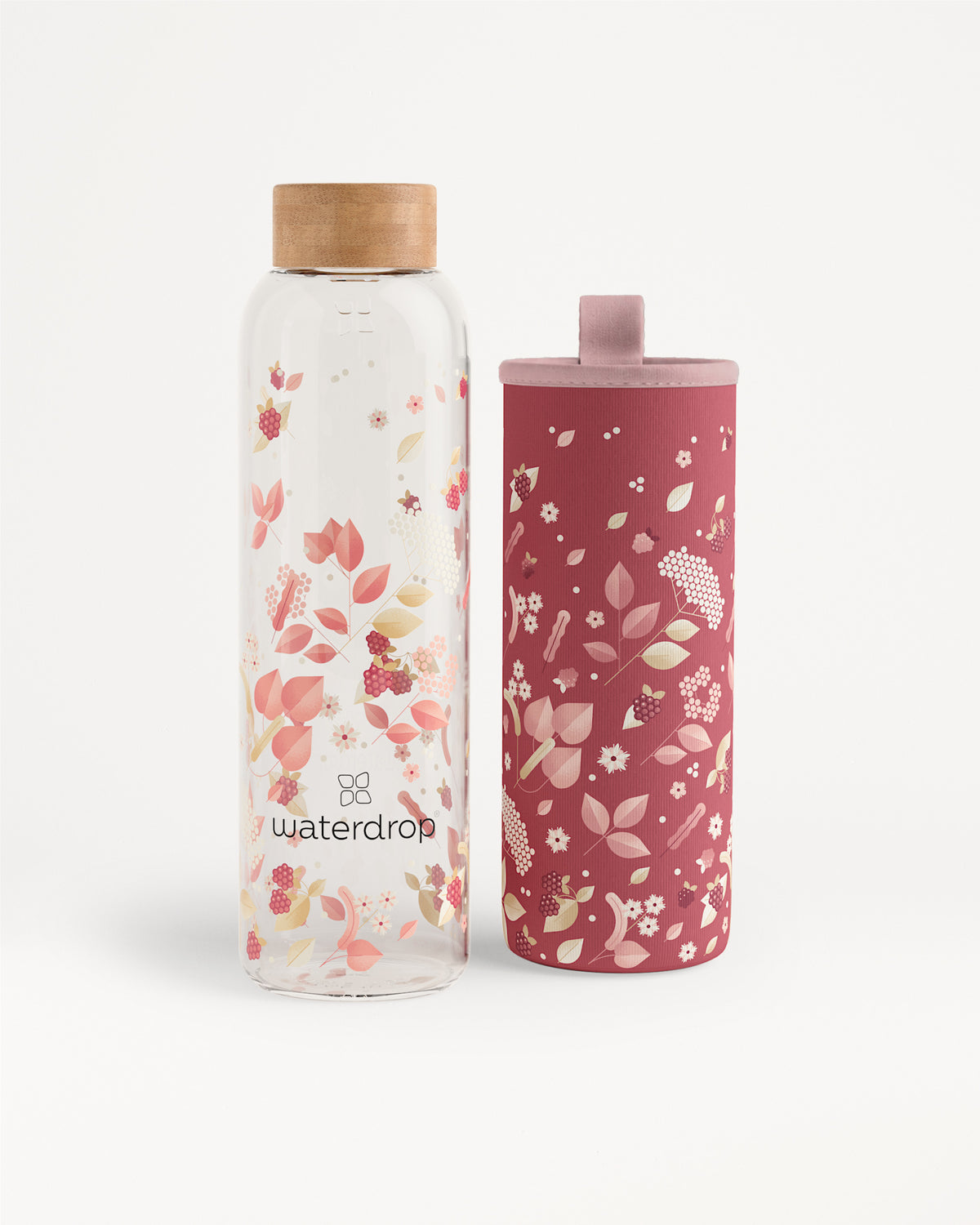 Two floral-patterned water bottles, one clear with a wooden cap and one pink with a matching lid.