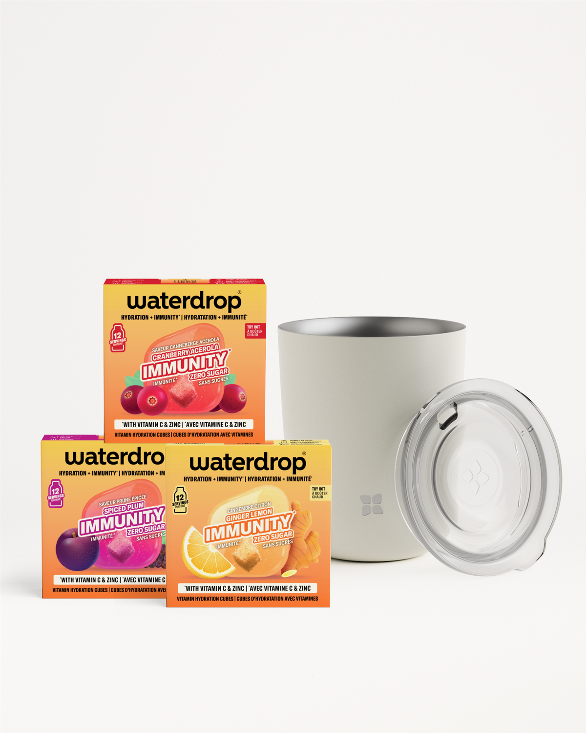 Three Waterdrop Immunity boxes with a white tumbler and clear lid against a light background.
