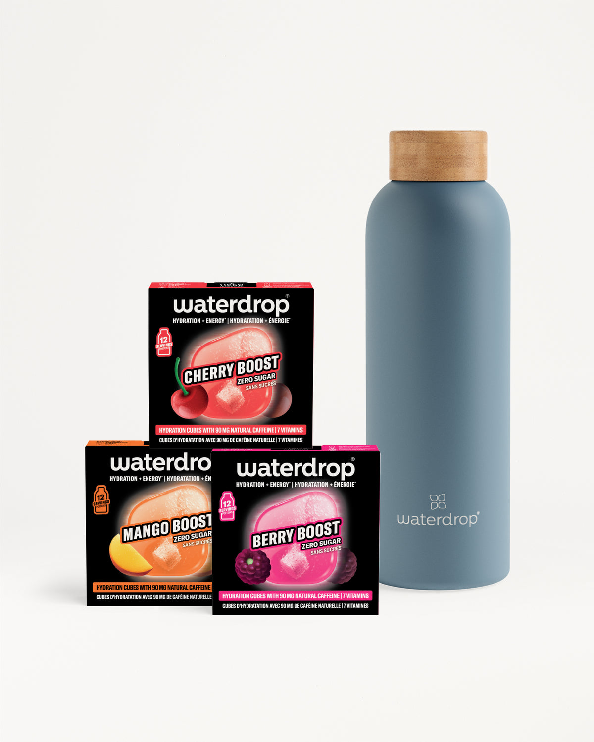 Set of three Waterdrop flavor boost boxes beside a tall blue reusable bottle with a wooden cap.