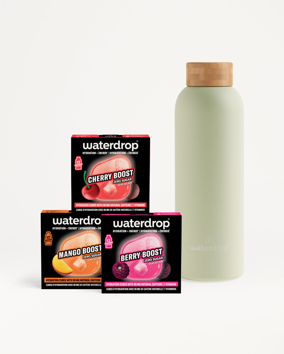 Three Waterdrop booster boxes (Cherry, Mango, Berry) beside a pale green bottle with a wooden cap.