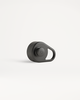 Pull-Up Cap in matte-black, featuring a raised button and integral loop for easy attachment. Designed for effortless hydration with a silicone mouthpiece, suitable for all.