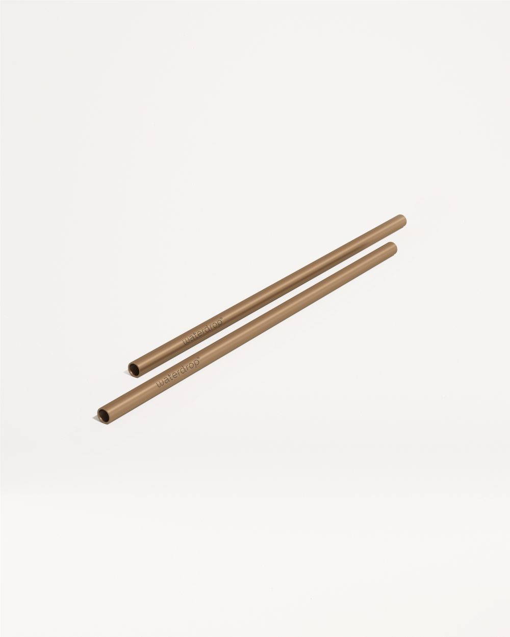 Goodie Straws: Gold‐coloured metal straws with waterdrop logo.